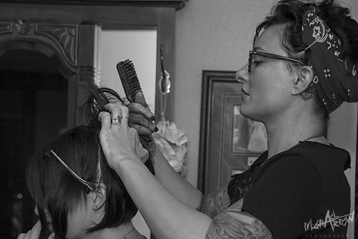 beautician working with a bride upstairs in the bridal suite